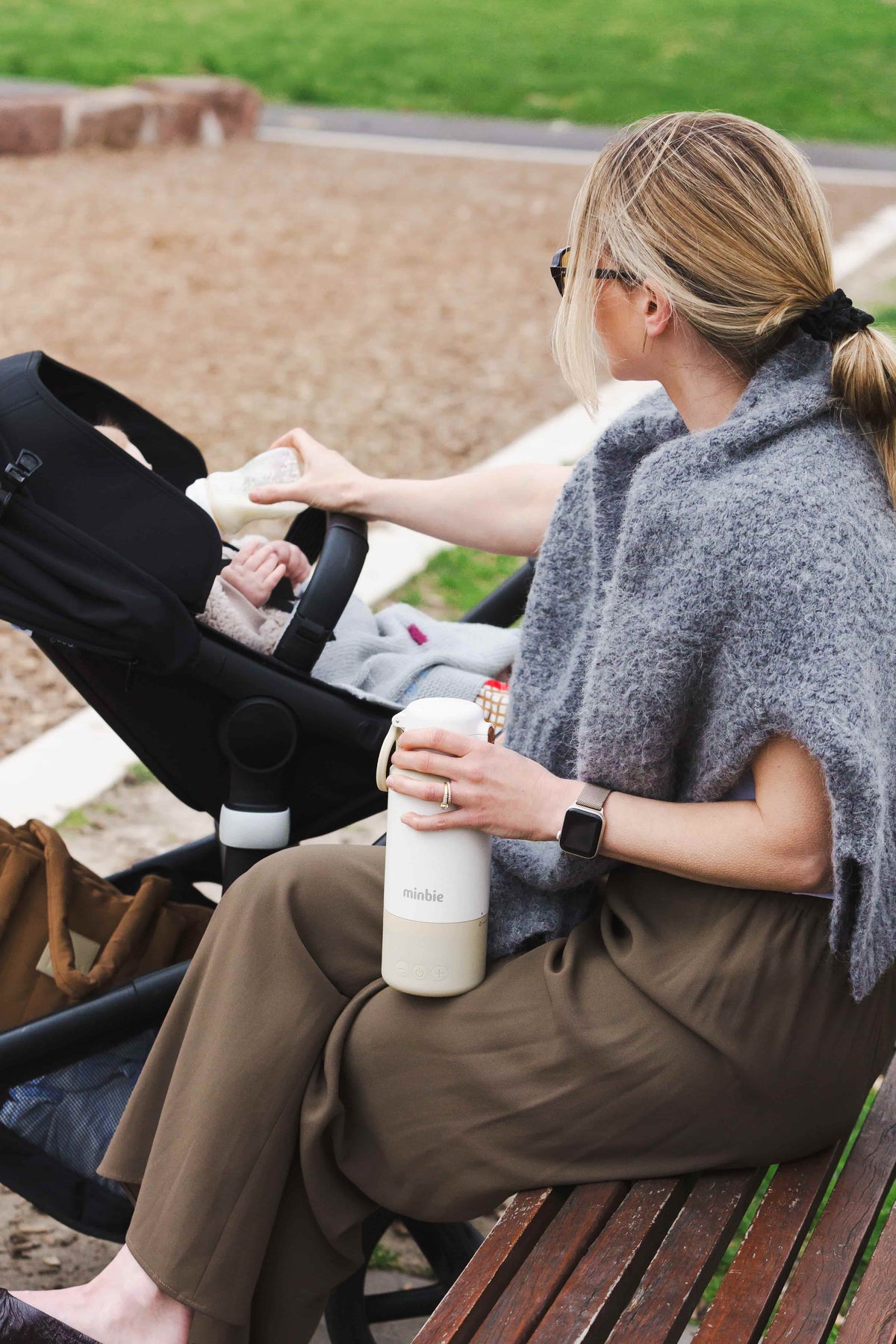 Ellen_with_the_minbie_portable_warmer_bottle_feeding_her_baby.jpg